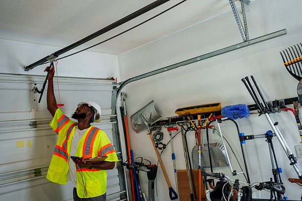 Professional Garage Door Panel Replacement technician working in Stanley, ND